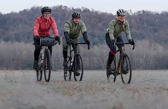 three gravelbikers riding in winter